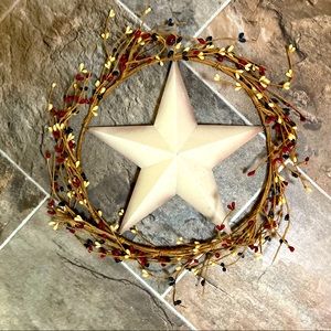 Wreath with star in the middle and red, yellow, and blue beaded branches